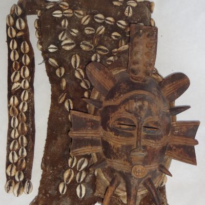 African Senufo Kpelie dance mask, with hood of fibre and cowrie shells
