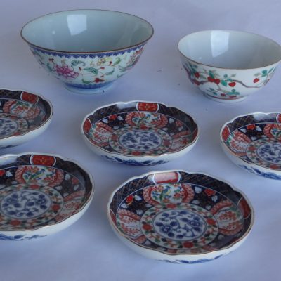 Collection of antique Chinese porcelain: two bowls and five Imari serving plates.