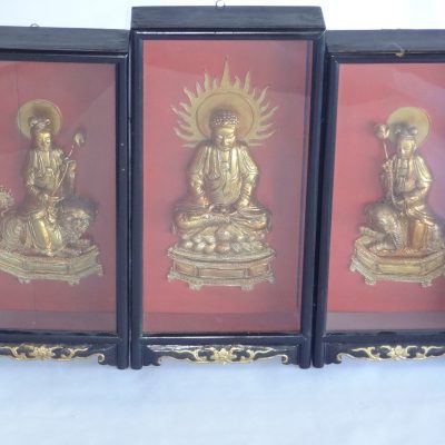 Three antique hand-carved wood and gold lacquer Chinese warrior and Buddha figures in ornate shadow box frames.