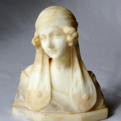 Marble bust of a beautiful woman in headdress