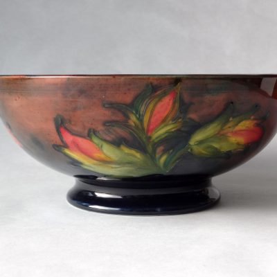 Moorcroft Hibiscus bowl with flambe glaze, painted Walter Moorcroft initials / side view