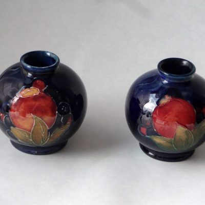 Pair of Moorcroft bud vases, pomegranate design.