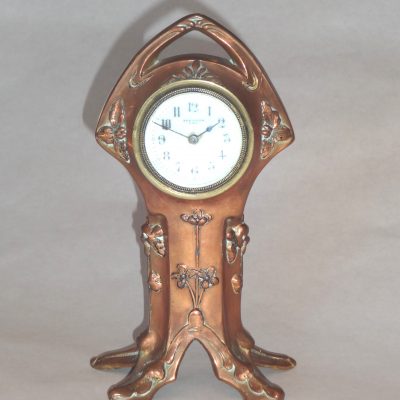 Art nouveau style mantle clock with ceramic face