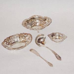 90.  Collection of miscellaneous pierced sterling silver serving pieces. Five pieces. Mid 20th century.