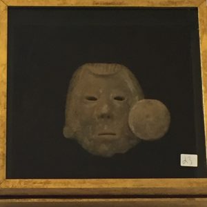 23. Hand carved face with Tribal earring (one missing).  In shadow box frame. Possible Mexican Aztec origin (Circa 1400AD). Purchased as authentic by a local collector for $450.00 in the 1970's.  
